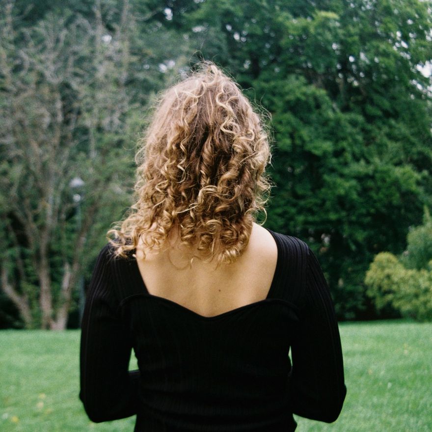 Shoulder-length natural blonde curls