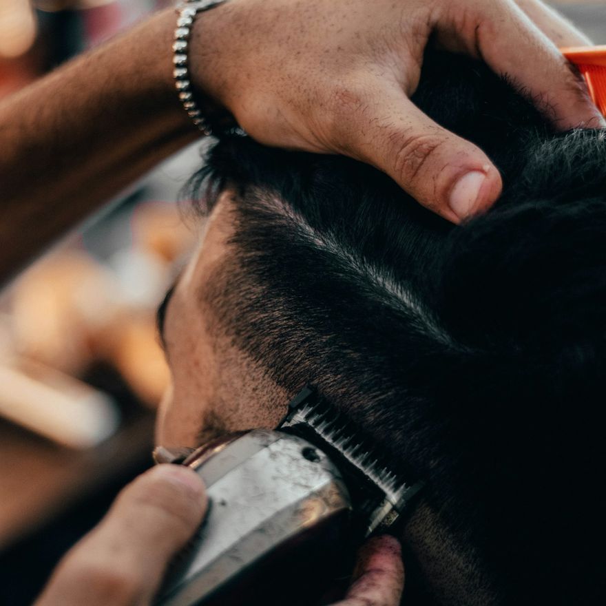 Men's clipper cut being finished