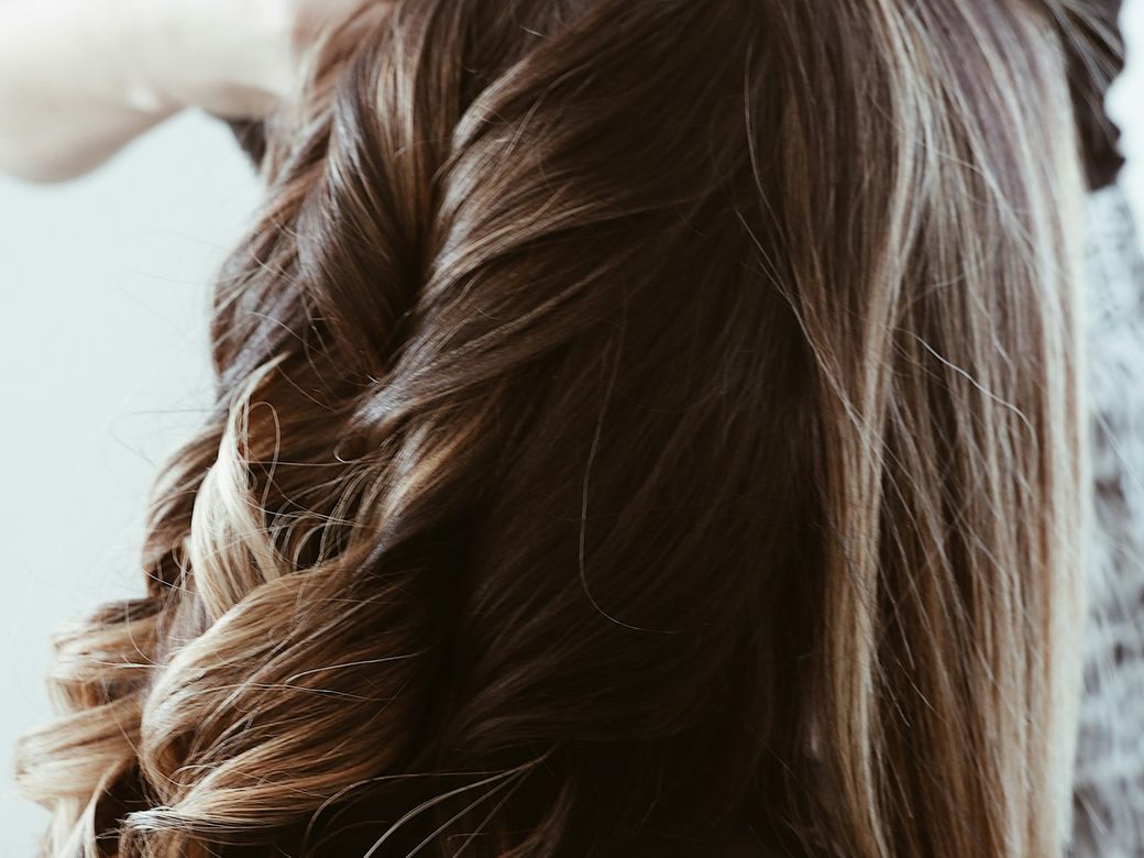 Brunette hair with a few bright highlighted pieces