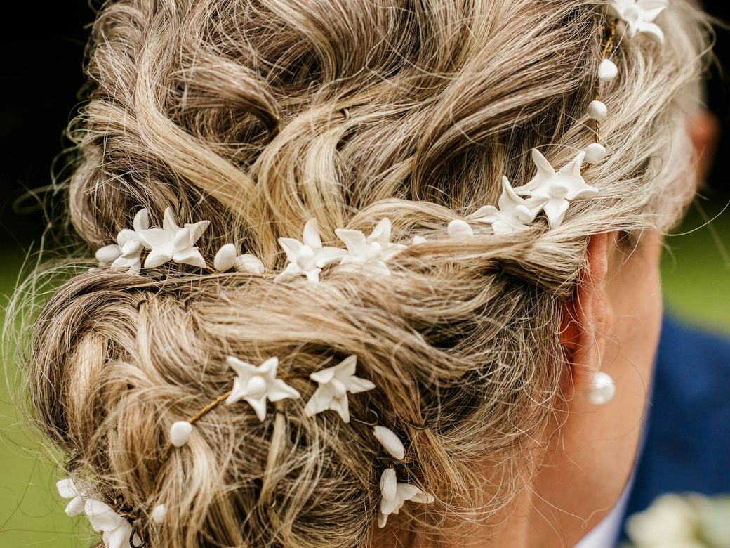 Styled updo with decorative hair pins